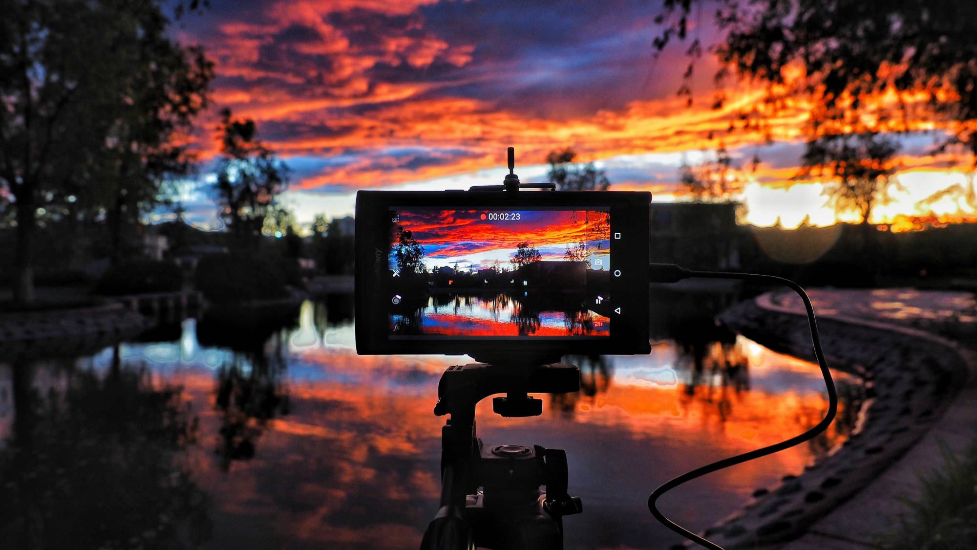 Camera on tripod setup during golden hour