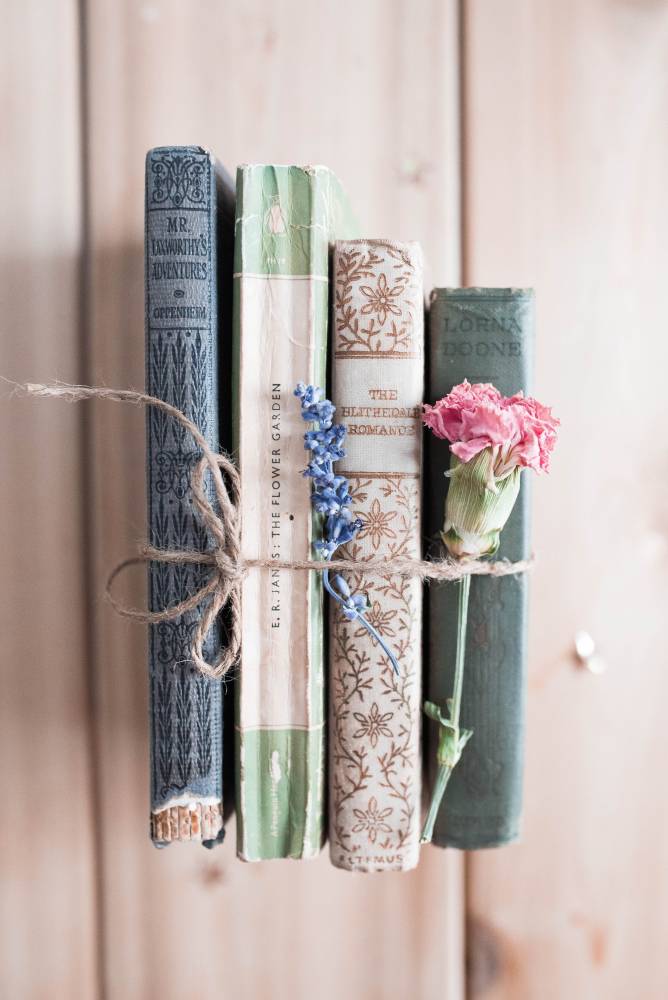 Books and a flower tied together with twine
