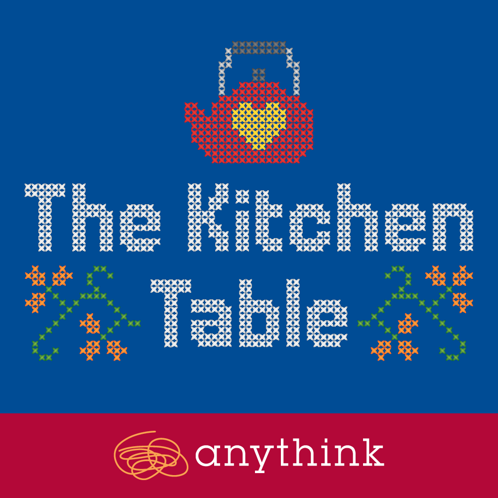 The Kitchen Table logo with cross-stich and a kettle