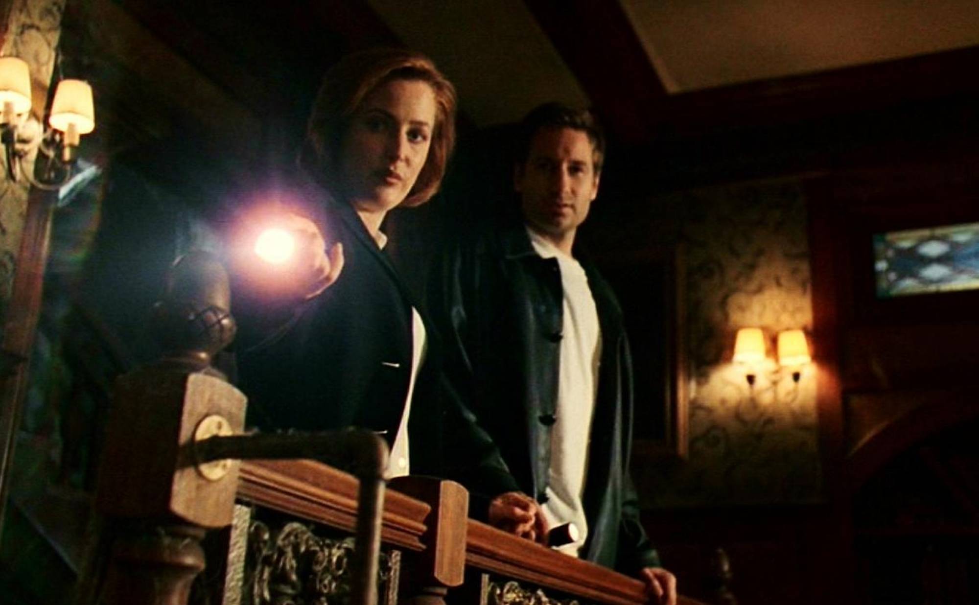 Mulder and Scully survey the scene