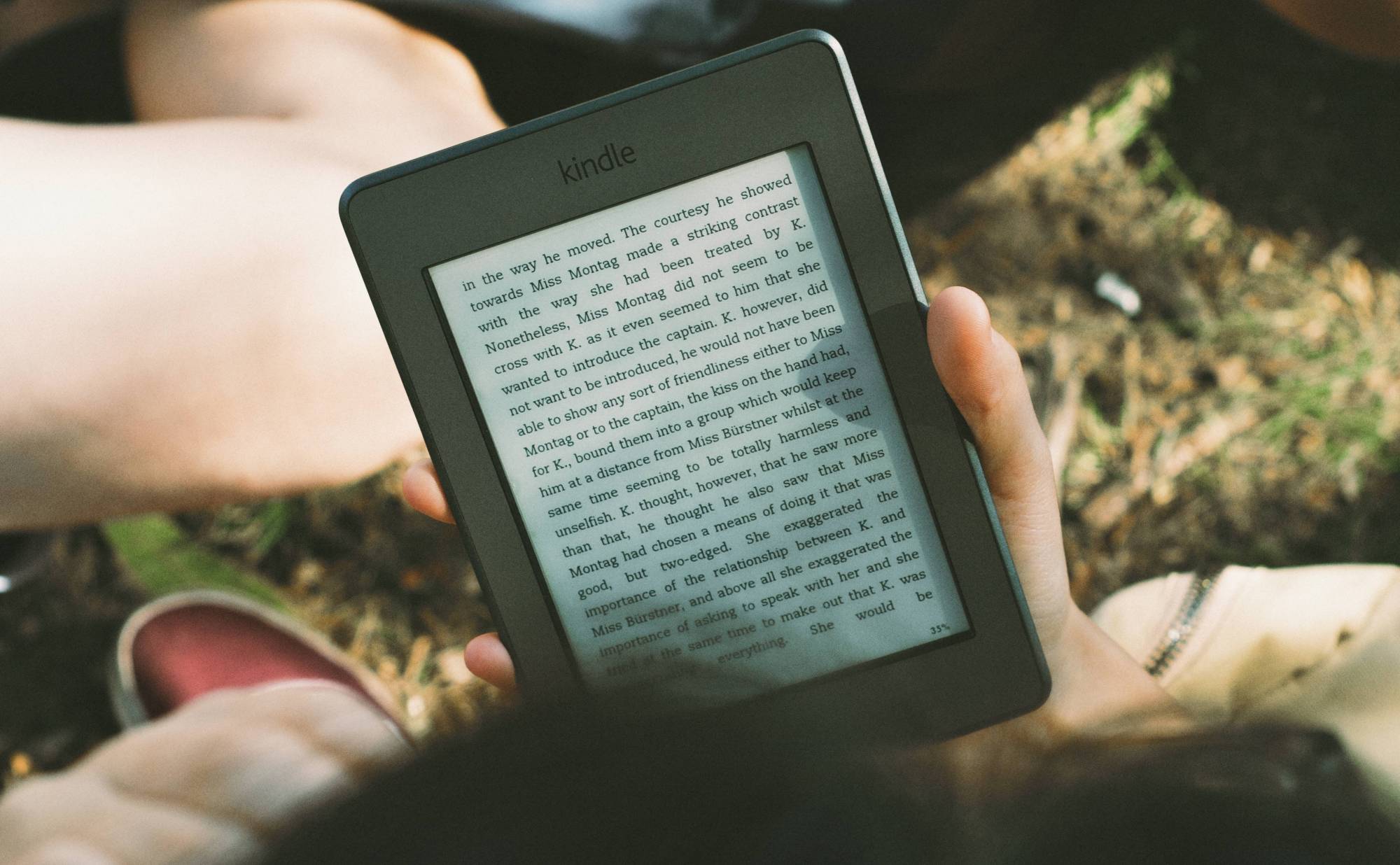 Photo of someone reading an ebook on an Kindle