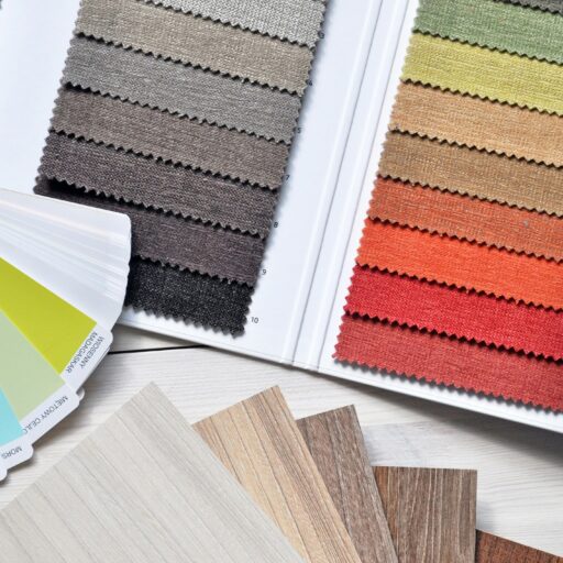 Colorful fabric and paint swatches laid out for design inspiration and material selection.